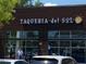 Exterior view of Taqueria del Sol with signage and handicap parking spaces at 5300 Peachtree Rd # 2309, Chamblee, GA 30341