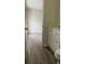 Open view of the bathroom leading to the bedroom with modern fixtures and finishes at 72 Belmonte Sw Cir, Atlanta, GA 30311
