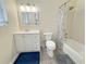 Bathroom featuring tub and shower, toilet, and bright vanity at 72 Belmonte Sw Cir, Atlanta, GA 30311