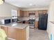 Kitchen area with stainless steel appliances, granite countertops, and wooden cabinetry at 72 Belmonte Sw Cir, Atlanta, GA 30311