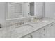 Bright bathroom with double vanity, marble countertop, and modern fixtures, offering a spa-like experience at 91 Webb St, Roswell, GA 30075