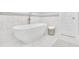 Clean bathroom features a standalone tub, decorative tiling, and a bright, airy atmosphere at 91 Webb St, Roswell, GA 30075