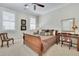 Comfortable bedroom with shuttered windows, wood furnishings and neutral decor offering a cozy retreat at 91 Webb St, Roswell, GA 30075