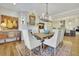 Dining room featuring an adjacent kitchen and a decorative fireplace at 91 Webb St, Roswell, GA 30075