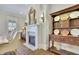 Dining room with a fireplace, hardwood floors, and vintage cabinetry at 91 Webb St, Roswell, GA 30075
