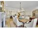 Spacious dining room with hardwood floors adjacent to the modern kitchen area at 91 Webb St, Roswell, GA 30075