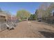 Spacious dog park with mature trees, wood chip ground cover, benches, and a secure fence at 91 Webb St, Roswell, GA 30075