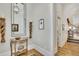 Inviting foyer with decorative mirror, hardwood floors, and stairway access at 91 Webb St, Roswell, GA 30075