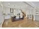 Spacious kitchen with granite island, pendant lighting, and hardwood floors at 91 Webb St, Roswell, GA 30075