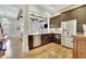 Modern kitchen featuring stainless steel appliances, wine storage, and granite countertops at 91 Webb St, Roswell, GA 30075