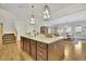 Spacious kitchen island featuring stone countertops and a stainless steel sink at 91 Webb St, Roswell, GA 30075