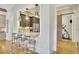 Modern kitchen with stainless steel appliances, bar seating area and home gym at 91 Webb St, Roswell, GA 30075