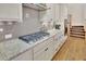 Kitchen featuring stone countertops, stainless appliances and a gas cooktop at 91 Webb St, Roswell, GA 30075