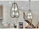 Bright kitchen featuring custom lighting, white cabinets, and stainless steel appliances at 91 Webb St, Roswell, GA 30075