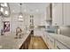 Elegant kitchen with granite countertops, modern appliances, and custom cabinetry at 91 Webb St, Roswell, GA 30075