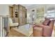 Spacious living room features custom built-ins, hardwood floors, a plush sofa, and natural light at 91 Webb St, Roswell, GA 30075