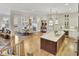 Open concept design showcasing the living room, dining area, and kitchen with island seating at 91 Webb St, Roswell, GA 30075