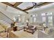 Bright living room featuring hardwood floors, ceiling fan, and comfortable seating arrangement at 91 Webb St, Roswell, GA 30075