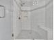 Modern shower featuring sleek glass doors, built-in bench, and decorative tiling for a luxurious feel at 91 Webb St, Roswell, GA 30075