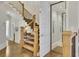 Elegant staircase with hardwood steps, black iron railings, and an elevator at 91 Webb St, Roswell, GA 30075