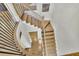 Wooden staircase with dark metal railing leading upstairs; hardwood floors at 91 Webb St, Roswell, GA 30075