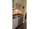 Stylish bar area with wine storage, granite countertop, and under-cabinet lighting adds a touch of luxury to the home at 112 Austin Dr, Sandy Springs, GA 30328