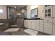 Bathroom featuring a large shower, dual sinks, vanity with storage, and tiled floors at 112 Austin Dr, Sandy Springs, GA 30328
