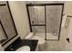 Updated bathroom featuring a tiled shower, granite countertop, and modern fixtures at 112 Austin Dr, Sandy Springs, GA 30328