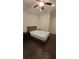 Clean bedroom featuring hardwood floors, a ceiling fan, and neutral paint at 112 Austin Dr, Sandy Springs, GA 30328