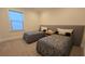 Inviting bedroom with two beds featuring stylish matching linens and a central nightstand at 112 Austin Dr, Sandy Springs, GA 30328