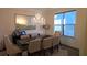 Bright dining room featuring a modern chandelier, ample natural light, and stylish decor offers a welcoming atmosphere at 112 Austin Dr, Sandy Springs, GA 30328
