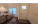 Welcoming dining area with elegant chandelier, large window, and stylish furniture creates a comfortable and inviting atmosphere at 112 Austin Dr, Sandy Springs, GA 30328
