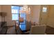 Elegant dining room featuring a crystal chandelier and a large table with seating for eight at 112 Austin Dr, Sandy Springs, GA 30328