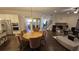 Bright dining room with modern light fixture, dark hardwood floors, and open floor plan at 112 Austin Dr, Sandy Springs, GA 30328
