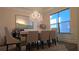 Elegant dining room with chandelier, large mirror and natural light creates a perfect space for entertaining and Gathering meals at 112 Austin Dr, Sandy Springs, GA 30328