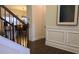 Elegant home hallway with hardwood floors, staircase, and decorative molding exudes sophistication and charm at 112 Austin Dr, Sandy Springs, GA 30328