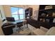 A stylish home office featuring built-in shelves, a modern desk, an ergonomic chair and lots of natural light at 112 Austin Dr, Sandy Springs, GA 30328