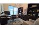A stylish home office featuring built-in shelves, a modern desk, an ergonomic chair and lots of natural light at 112 Austin Dr, Sandy Springs, GA 30328