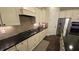 Well-equipped kitchen showcases stainless steel appliances and stylish stone backsplash at 112 Austin Dr, Sandy Springs, GA 30328