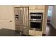 Modern kitchen features stainless steel appliances, light cabinets, and a sleek black countertop at 112 Austin Dr, Sandy Springs, GA 30328