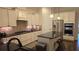 Modern kitchen featuring white cabinets, black countertops, stainless steel appliances, and spacious island is perfect for cooking at 112 Austin Dr, Sandy Springs, GA 30328