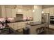 Modern kitchen with white cabinets, black countertops, stainless steel appliances, and island offers functionality and style at 112 Austin Dr, Sandy Springs, GA 30328