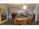 Open-concept living area with a dining table, fireplace, and cozy seating at 112 Austin Dr, Sandy Springs, GA 30328