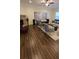 Bright living room with a stone fireplace, comfortable seating, and wood flooring at 112 Austin Dr, Sandy Springs, GA 30328