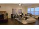 Bright living room features a fireplace, comfortable seating, and a large window view at 112 Austin Dr, Sandy Springs, GA 30328