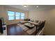 Light-filled living room with hardwood floors, large sectional couch and iron railing at 112 Austin Dr, Sandy Springs, GA 30328