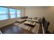 Bright living room featuring a sectional sofa, hardwood floors, and iron railings at 112 Austin Dr, Sandy Springs, GA 30328