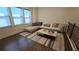 Bright and airy living area with large windows, a comfortable sofa, and a modern coffee table on a striped rug at 112 Austin Dr, Sandy Springs, GA 30328