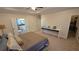 Inviting main bedroom features a tray ceiling, carpet, and access to an en-suite bathroom and walk-in closet at 112 Austin Dr, Sandy Springs, GA 30328