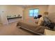Well-appointed main bedroom with a bed, desk, and a large window allowing natural light to illuminate the space at 112 Austin Dr, Sandy Springs, GA 30328